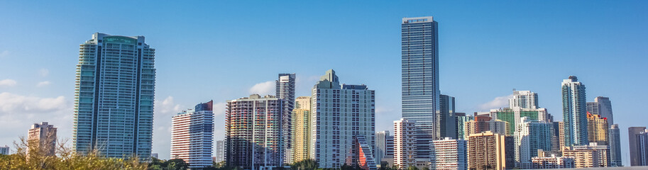 Obraz na płótnie Canvas Panorama of Miami skyscrapers and skyline. Miami South Beach in Downtown District in sunny day. Apartment and business buildings in Miami Beach, Florida.