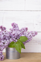 lilac flowers on white wooden background