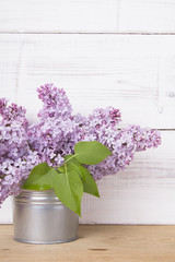 lilac flowers on white wooden background