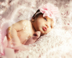 Newborn baby girl with pink tutu.