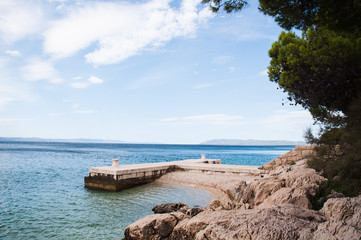 coast of tucepi mare stones and blue sky