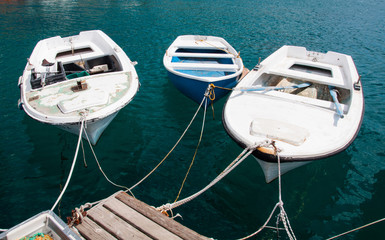 three old fishing boats in harbour