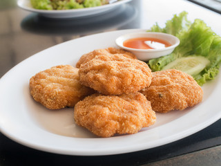 fried fish patty( fried fish-paste balls ) on white plate, Thai food style