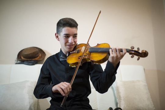 Teen Playing A Violin