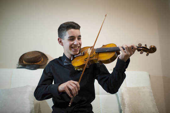 Teen playing a violin