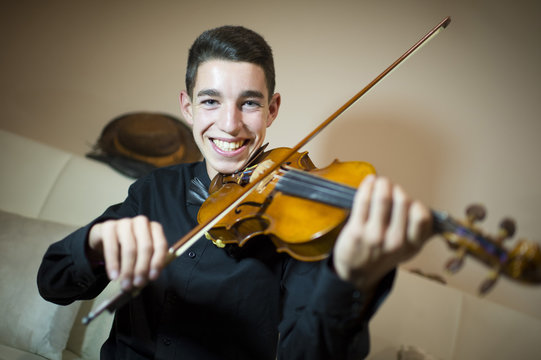 Teen playing a violin