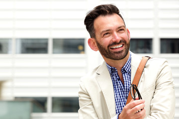 Happy mature man with beard outdoors