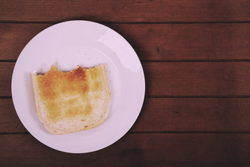 Slices of toast against a rustic background Vintage Retro Filter