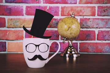 Coffee cup with a black hipster mustache  Vintage Retro Filter.