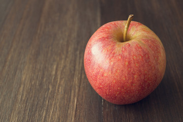 Apple on wooden rustic background