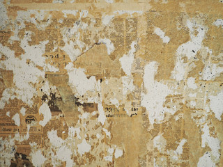 walls are covered with old newspapers