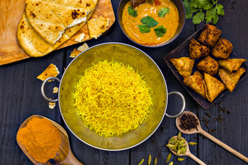Indian pilau rice in balti dish served with chicken tikka masala