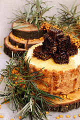 Homemade honey cakes with honeycom and sea buckthorn. Autumn still life. 