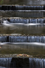 Beautiful waterfall in the autumn park