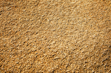 Light-brown rough surface.