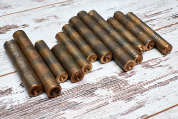 acentropinae bronze bars scratched on a white background