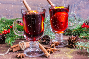 christmas mulled wine with cinnamon sticks, anise and orange