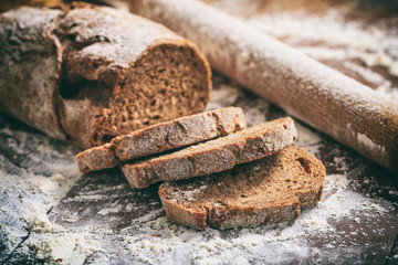 Baked sliced bread on a wooden surface
