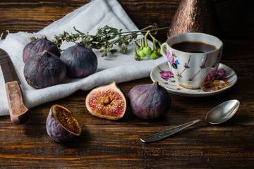 Cup of coffee with ripe figs for dessert