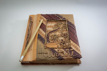 pencil and entic book on white backgrounds