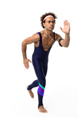 Sportive african man in headphones running over white background.