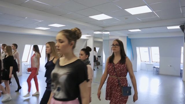 In model school women are preparing for defile.