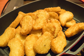 chicken nuggets served in pan