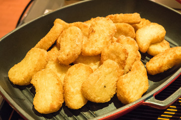 chicken nuggets served in pan