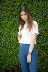 Naklejka na ściany i meble Portrait of thai chinese adult beautiful girl Denim blue travel relax and smile