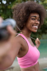 Fototapeta na wymiar portrait of afro female runner cross training on beach