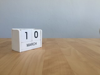 March 10th. March 10 white wooden calendar on vintage wood abstr
