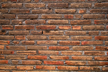 close-up of an old brick wall that is damaged
