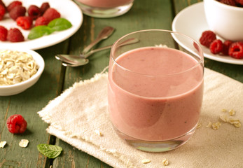 Healthy berry with raspberry, oatmeal and mint in a glass