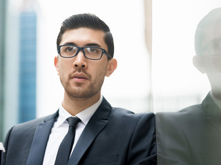 Fototapeta premium Portrait of handsome businessman outdoor