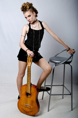 Obraz na płótnie Canvas rock girl with guitar