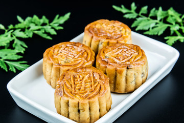 Mooncake for the Chinese Mid Autumn festival, on black background
