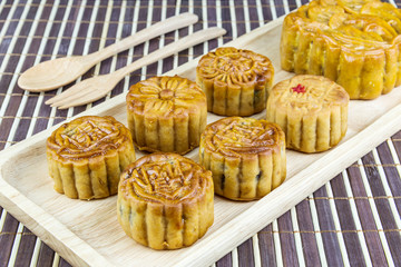 Mid-Autumn Festival moon cake on bamboo tablemat. Chinese mid autumn festival food.