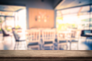 Wood table with coffee shop blur