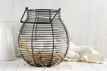 Fototapeta na wymiar Eggs in wire basket