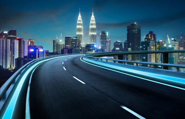 Highway overpass motion blur with city background . night scene .