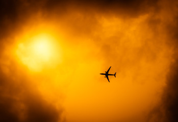 Commercial passenger plane in the golden sky