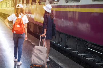 Happy young couple on railway station