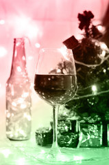 gradient red green color with wine glass and Christmas decoratio
