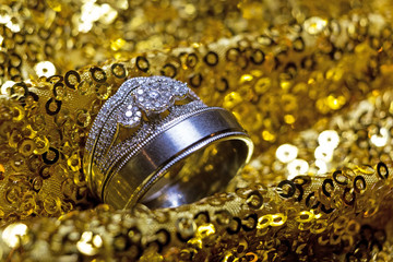 Wedding rings stacked on beautiful background 4