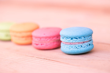 macarons sweet beauty dessert on wood background pink color tone.