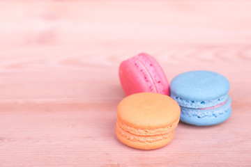 macarons sweet beauty dessert on wood background pink color tone.