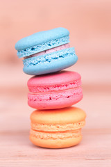 macarons sweet beauty dessert on wood background pink color tone.