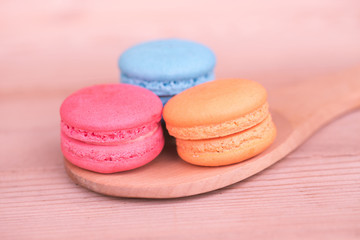 macarons sweet beauty dessert on wood background pink color tone.