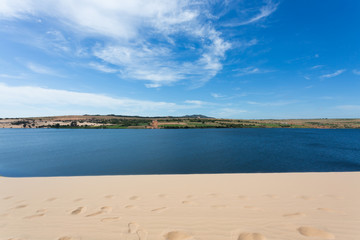 footprint on white sand dune desert and lake in Mui Ne, Vietnam