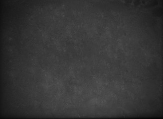 Empty blank black chalkboard with chalk traces.